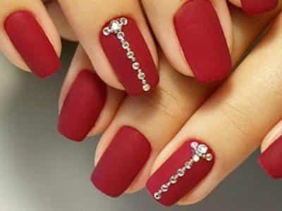 Red nail with rhinestones