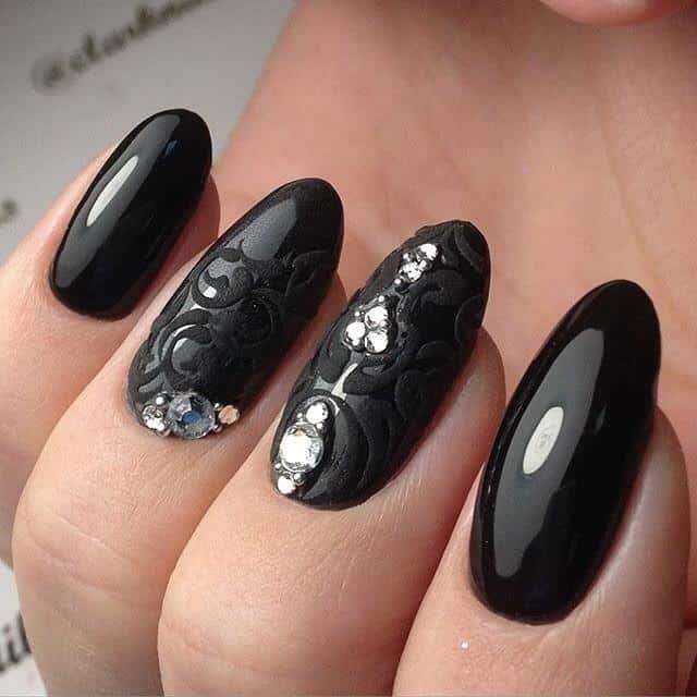 black manicure with rhinestones